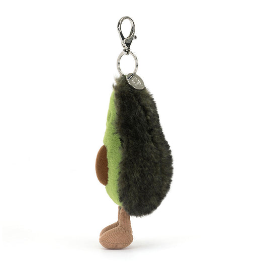 Jellycat Amuseables Avocado plush bag charm from the side, showing the dark green skin and the clasp