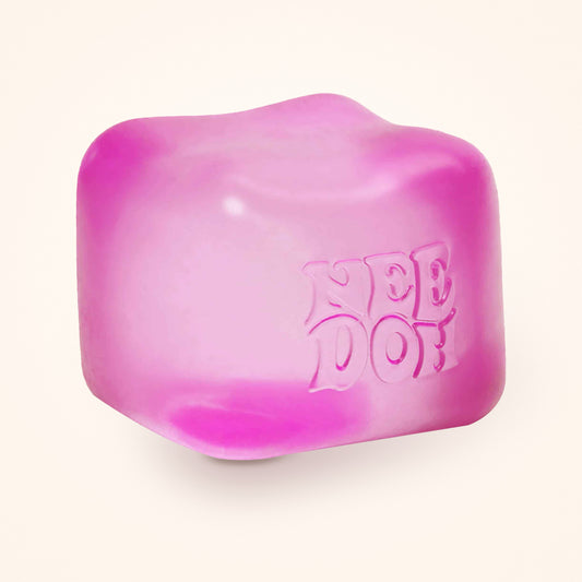 Pink NeeDoh Nice Cube squishy on a cream background