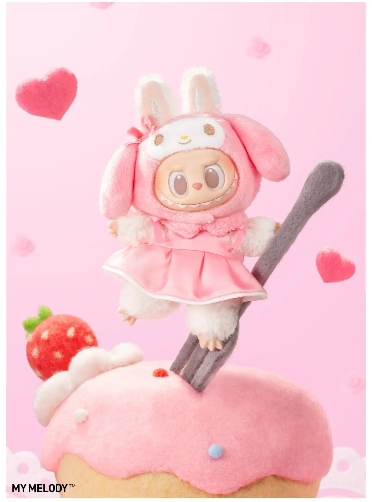 My Melody design from Labubu x Hello Kitty and Friends, in a pink dress, perched on a fork above a cupcake
