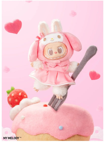 My Melody design from Labubu x Hello Kitty and Friends, in a pink dress, perched on a fork above a cupcake
