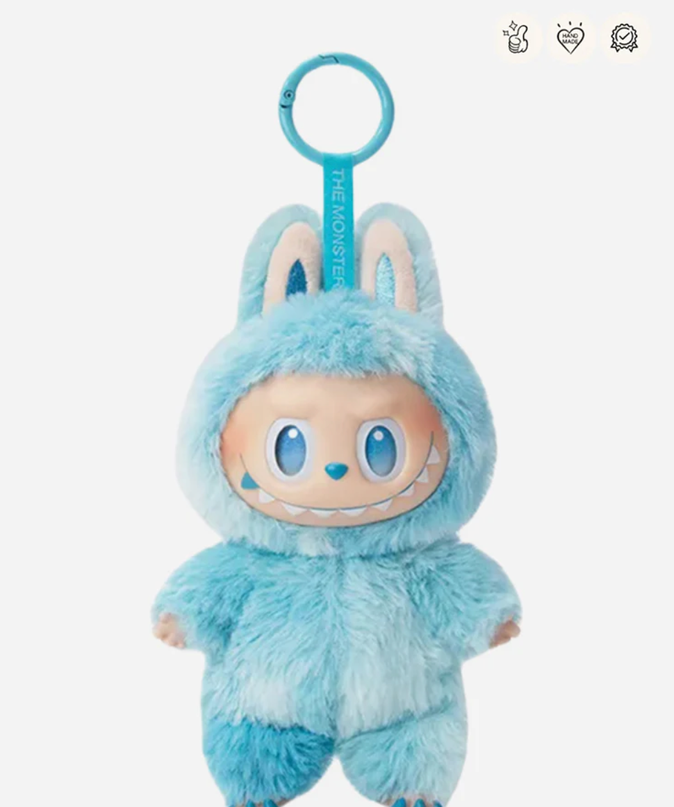 Hope, the blue Labubu Big into Energy pendant with a blue keyring; small badge icons top right