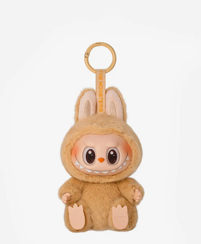 Baba, the caramel brown Labubu Have a Seat figure, on a gold keyring