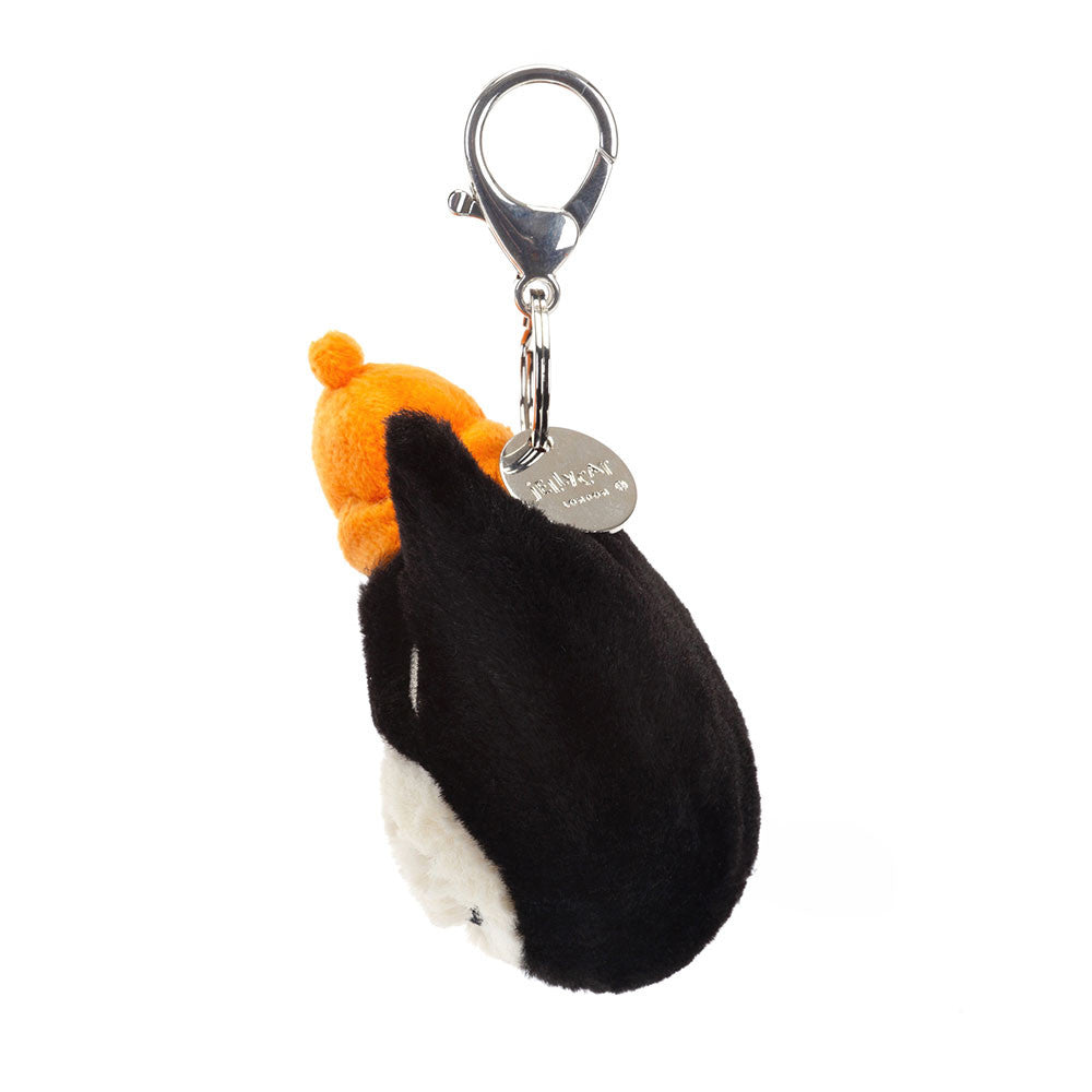 Jellycat Jack Cat 25th Anniversary bag charm from the side, showing the orange hat, clasp and round metal tag