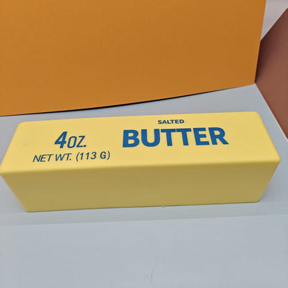Mini Butter Squishy, about 5.3 in, on a white table