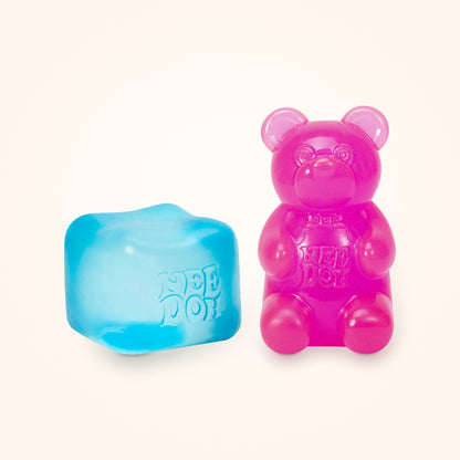 Squishy Gift Box Duo: a blue NeeDoh Nice Cube next to a pink NeeDoh Gummy Bear, shown to scale on a cream background