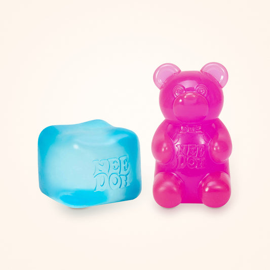 Squishy Gift Box Duo: a blue NeeDoh Nice Cube next to a pink NeeDoh Gummy Bear, shown to scale on a cream background