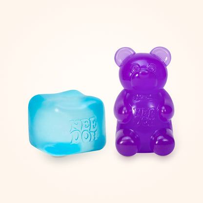 Squishy Gift Box Duo: a blue NeeDoh Nice Cube next to a purple NeeDoh Gummy Bear, shown to scale on a cream background