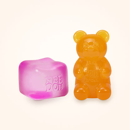 Squishy Gift Box Duo: a pink NeeDoh Nice Cube next to a orange NeeDoh Gummy Bear, shown to scale on a cream background