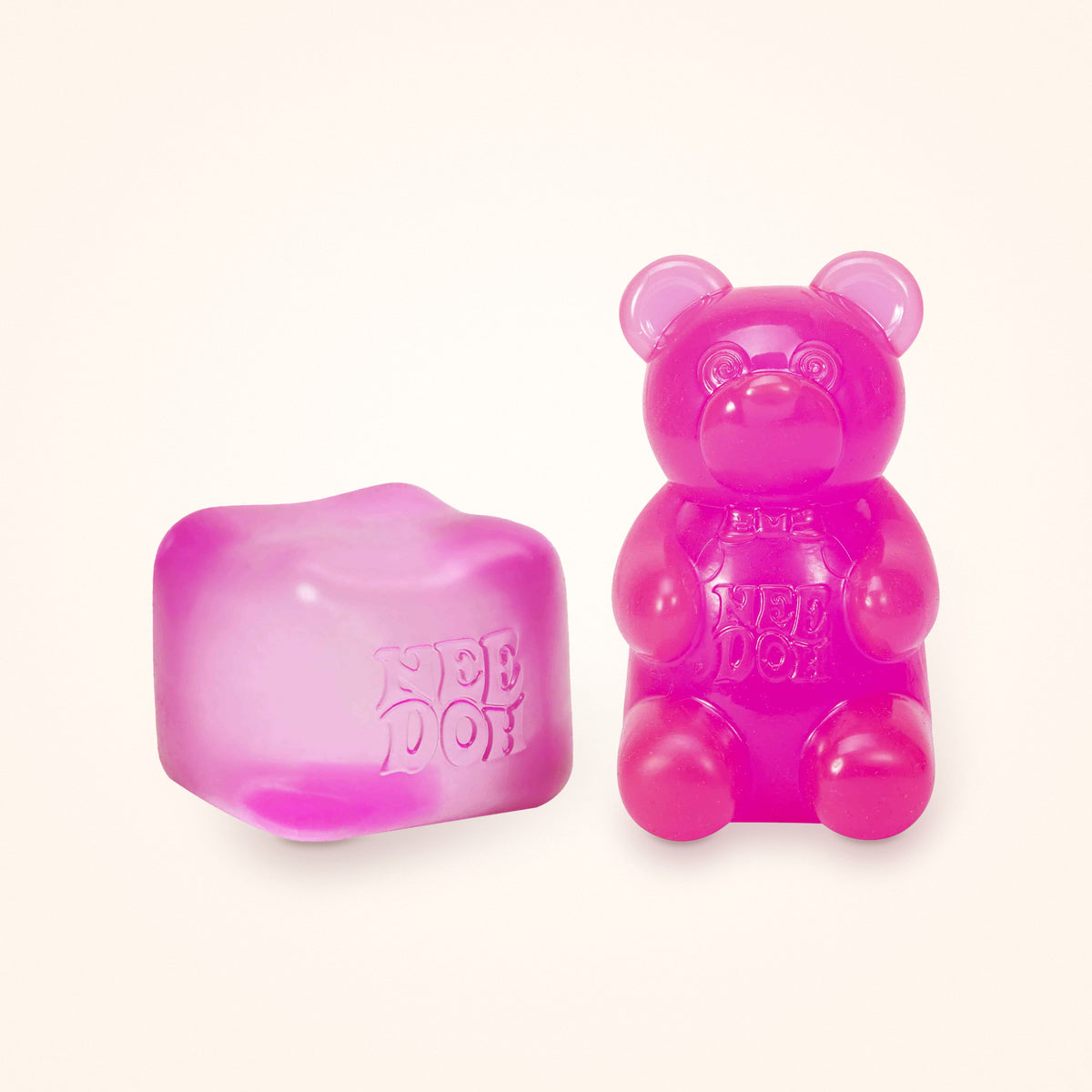 Squishy Gift Box Duo: a pink NeeDoh Nice Cube next to a pink NeeDoh Gummy Bear, shown to scale on a cream background