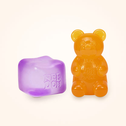 Squishy Gift Box Duo: a purple NeeDoh Nice Cube next to a orange NeeDoh Gummy Bear, shown to scale on a cream background
