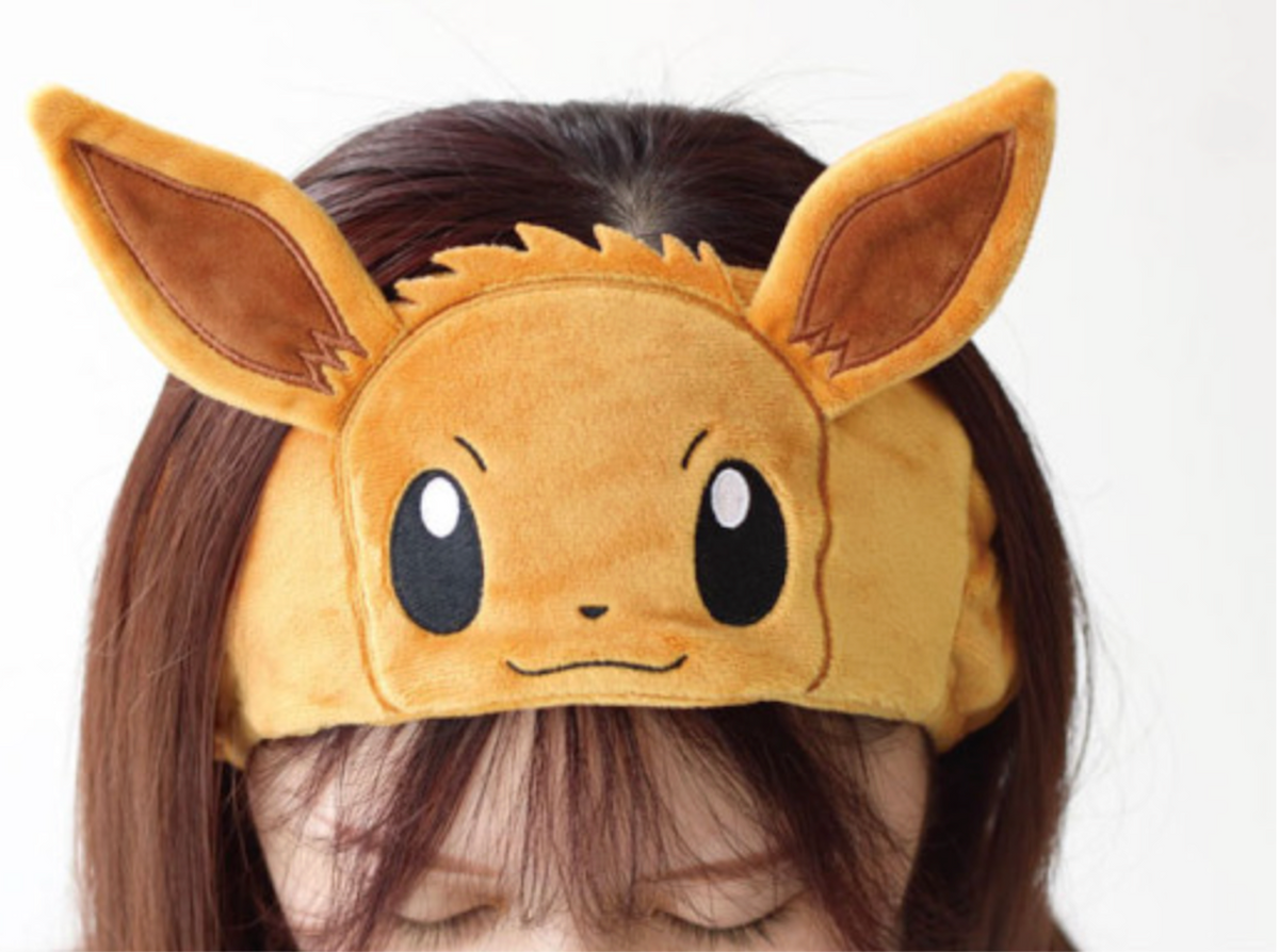 Eevee Pokemon Hair Band worn by a model with long brown hair, the ears standing up above the forehead