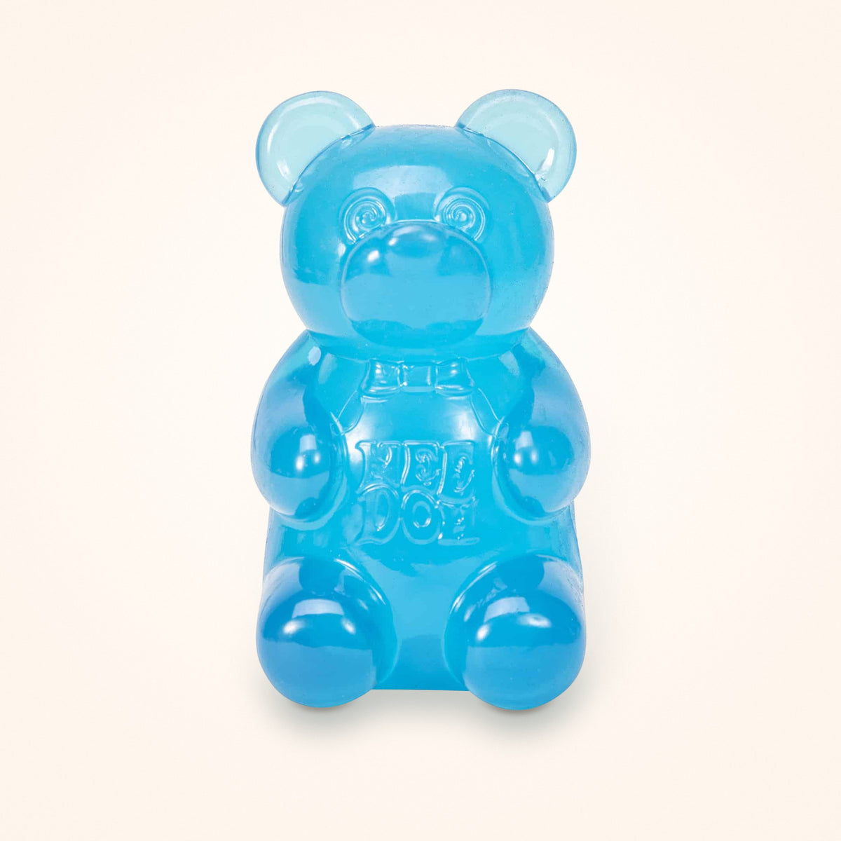 Blue NeeDoh Gummy Bear squishy on a cream background