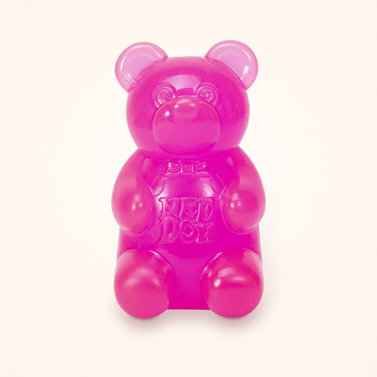 Pink NeeDoh Gummy Bear squishy on a cream background
