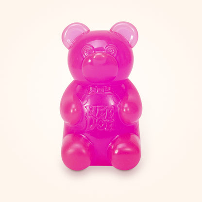 Pink NeeDoh Gummy Bear squishy on a cream background