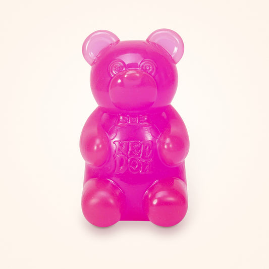 Pink NeeDoh Gummy Bear squishy on a cream background