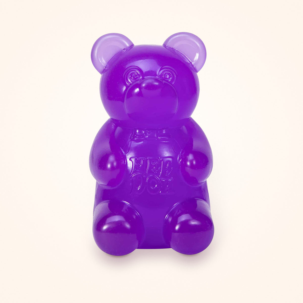 Purple NeeDoh Gummy Bear squishy on a cream background