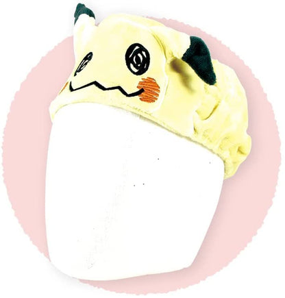 Mimikyu Pokemon Hair Band worn on a white mannequin head, against a pink circle